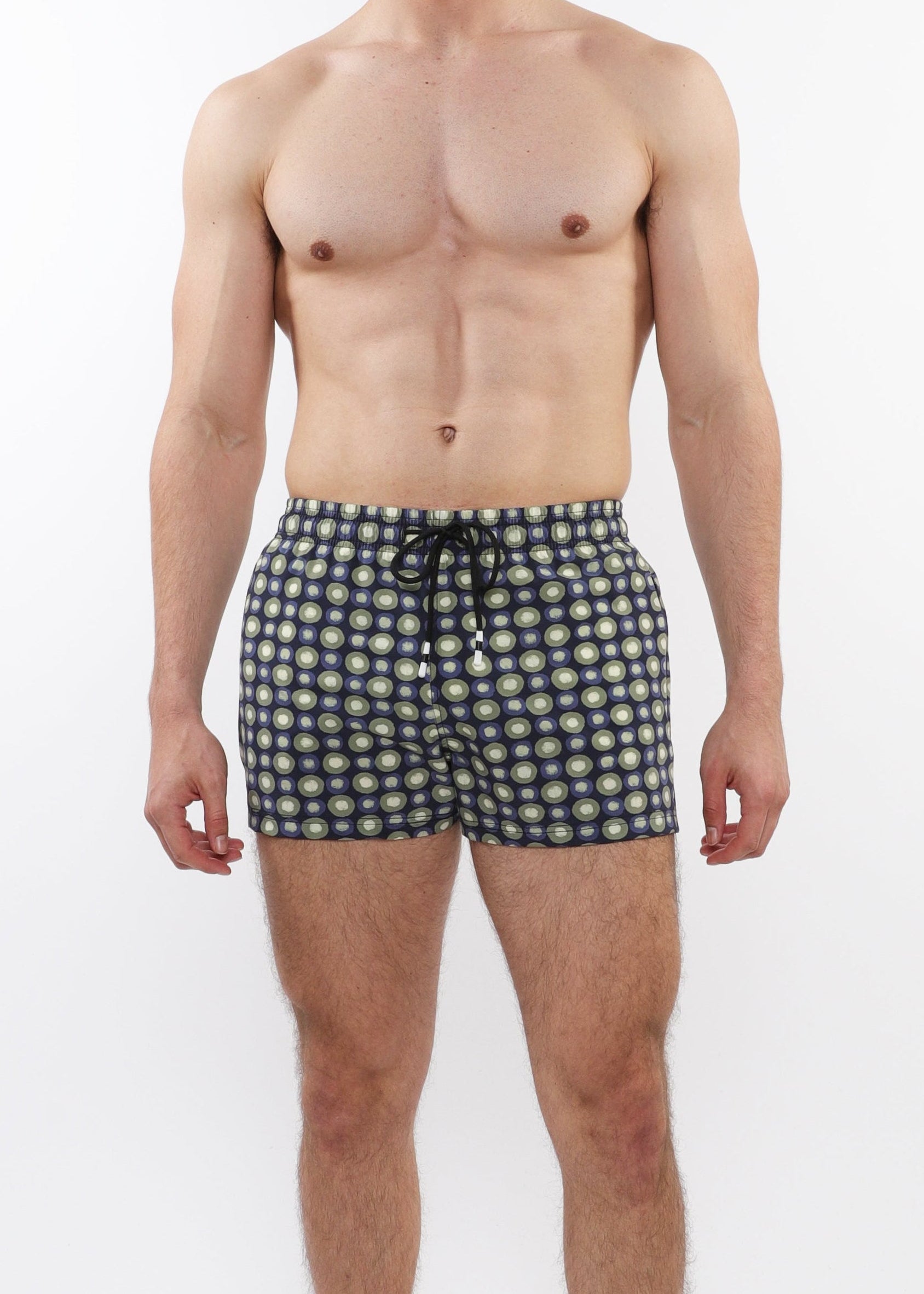 Man wearing black and white checkered boxer shorts on a white background