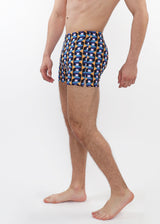 Person wearing a patterned swimsuit on a white background